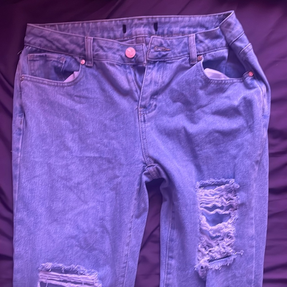Vintage play boy ripped jeans.